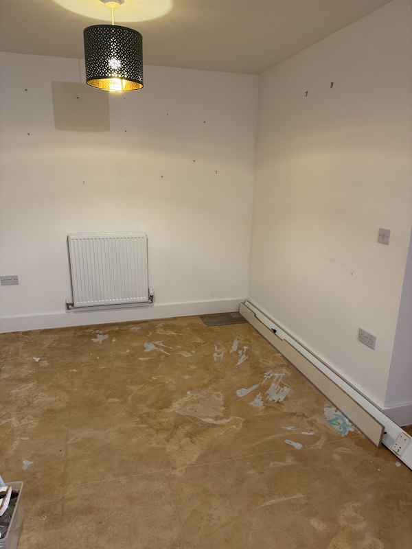 A photograph of a lino-less kitchen floor.